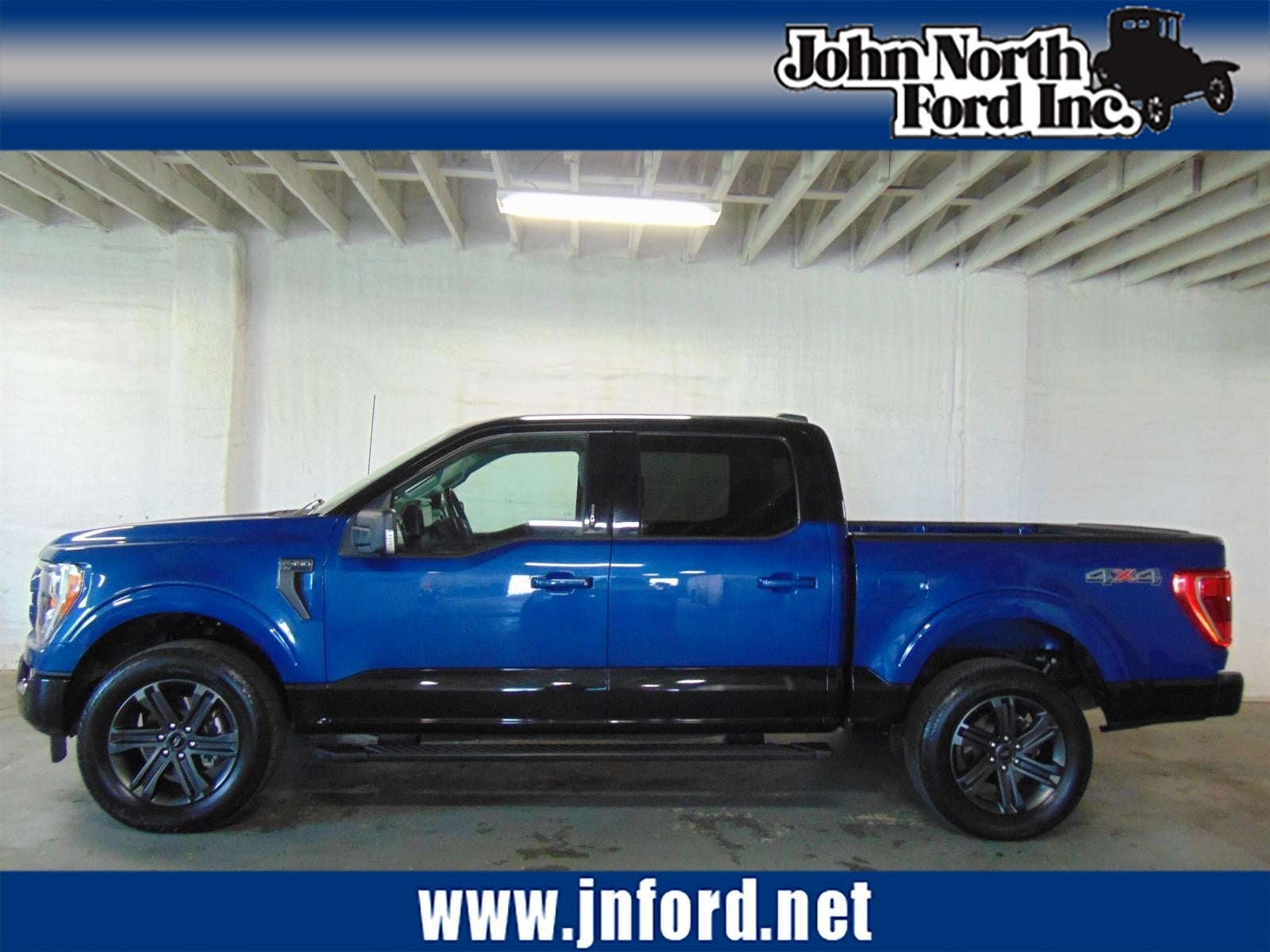 2023 Ford F-150 XLT in Atlas Blue/Agate Black (B3/Um) — front three-quarter view