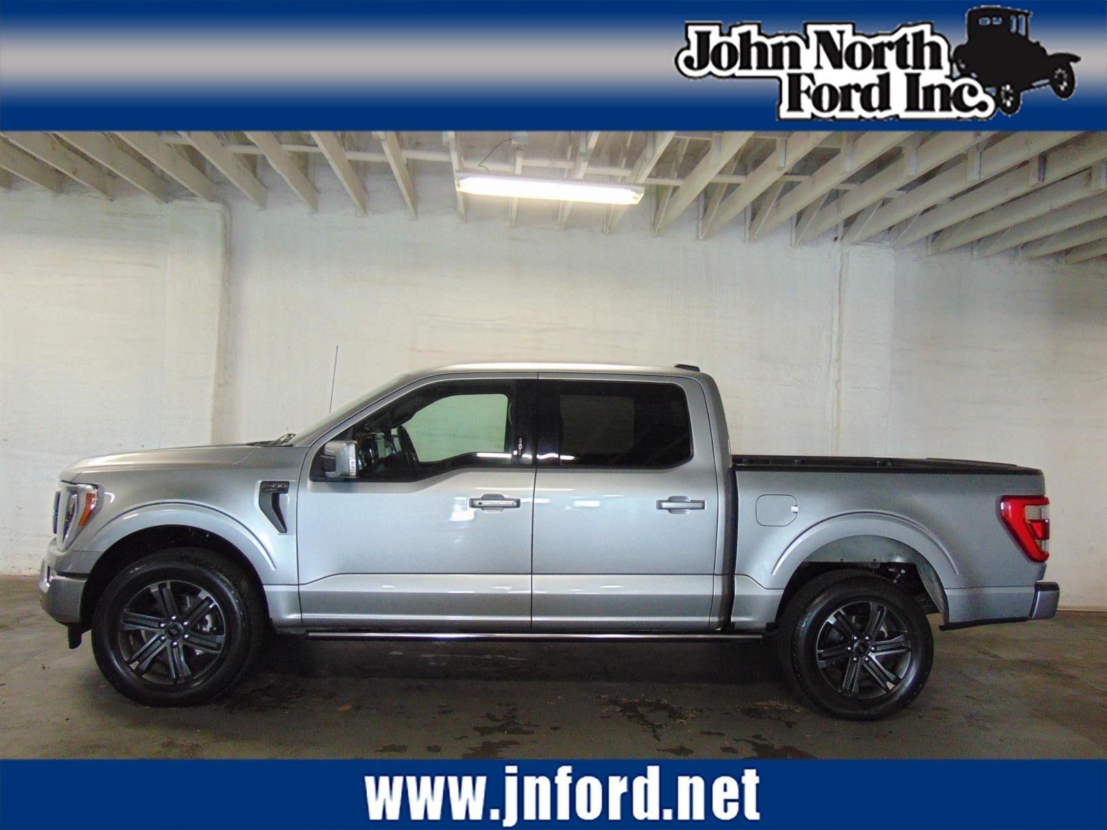 2023 Ford F-150 Lariat in Iconic Silver (Js) — front three-quarter view