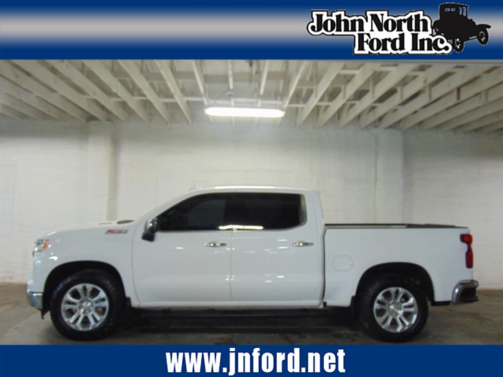 2023 Chevrolet Silverado 1500 LTZ in Summit White (Gaz) — front three-quarter view